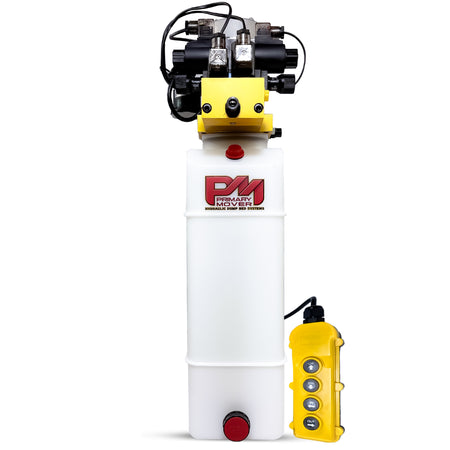 Primary Mover 12Vdc Single Double Pump with a white and yellow machine, yellow remote, and black wires for telescopic dump trailers and jacks.