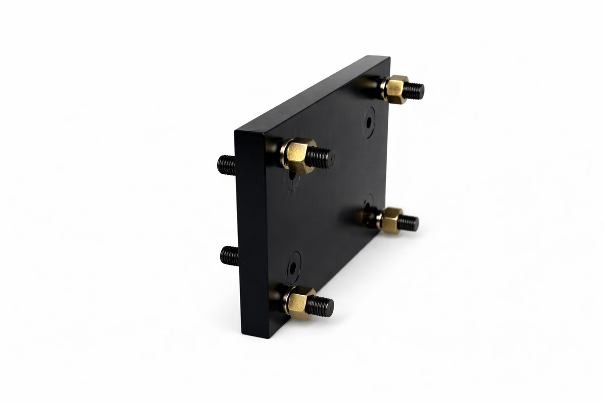 **Title:** Bolt-On Transition Plate for Trailer Jacks

**Meta Description:** Adapt your trailer for Primary Mover jacks with our bolt-on transition plate, converting bolt patterns from 5.5” x 3.5” to 8” x 3.5”. No welding needed.

**Alt Text:** Black rectangular plate with four threaded studs for converting jack bolt patterns on trailers.