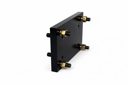 **Title:** Bolt-On Transition Plate for Trailer Jacks

**Meta Description:** Adapt your trailer for Primary Mover jacks with our bolt-on transition plate, converting bolt patterns from 5.5” x 3.5” to 8” x 3.5”. No welding needed.

**Alt Text:** Black rectangular plate with four threaded studs for converting jack bolt patterns on trailers.