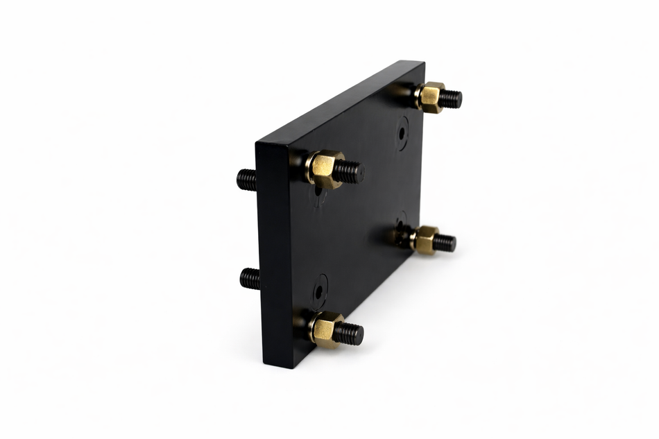 **Title:** Bolt-On Transition Plate for Trailer Jacks

**Meta Description:** Adapt your trailer for Primary Mover jacks with our bolt-on transition plate, converting bolt patterns from 5.5” x 3.5” to 8” x 3.5”. No welding needed.

**Alt Text:** Black rectangular plate with four threaded studs for converting jack bolt patterns on trailers.