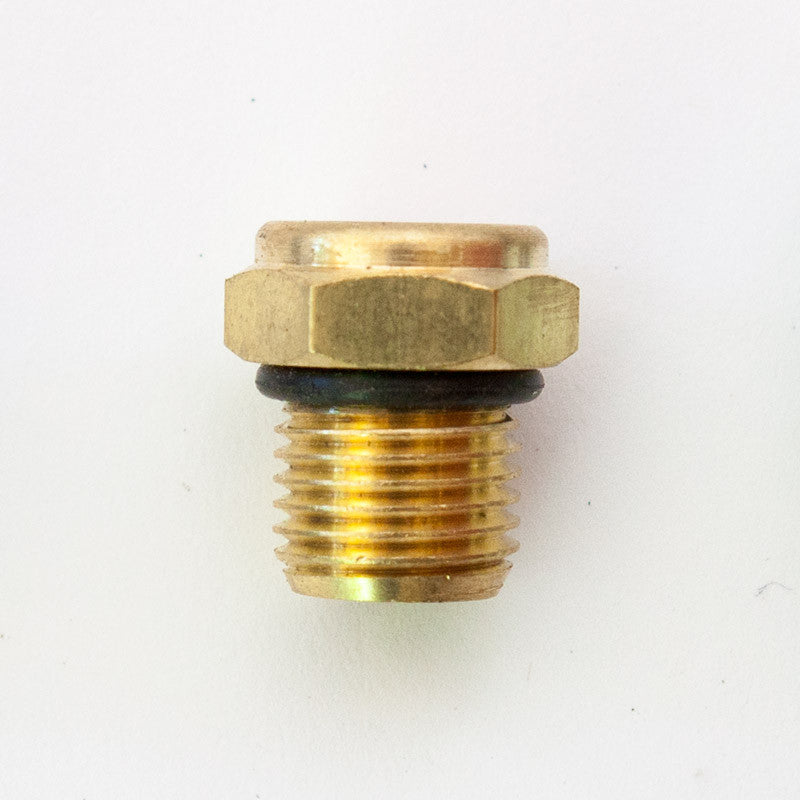 A close-up of a gold and black metal bolt, a fastener for household hardware, resembling a circular object with brass pipe details, fitting the Breather #6 SAE product description.